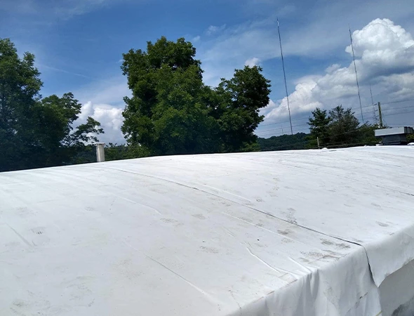 Skilled roofers performing detailed roof repairs after storm damage