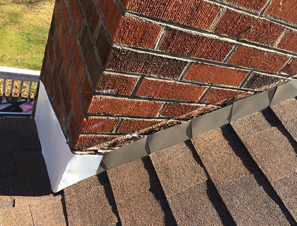 Weather-damaged roof replaced with modern, durable roofing system